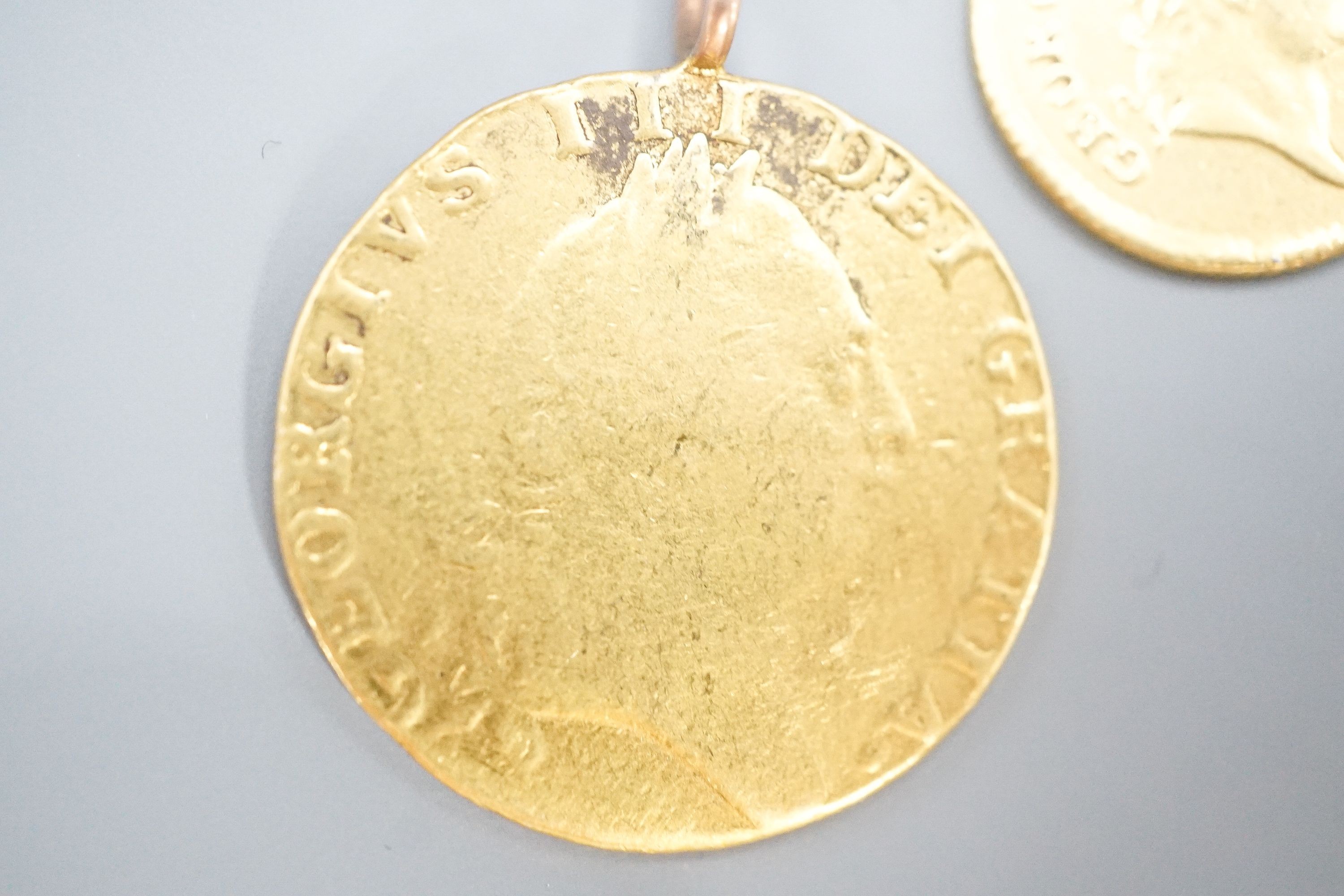 A George III 1788 gold guinea, now with pendant loop and an 1804 gold one third guinea(hole).